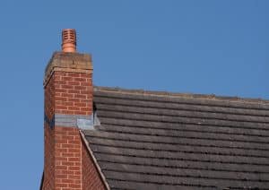 Chimney Pot On Red Brick Chimney Stack And Tiled Roof